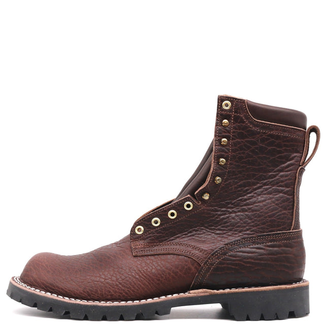 A dark brown leather lace-up boot with a textured grain finish, brass eyelets, and a black unit lug sole, shown from a side profile on a white background.