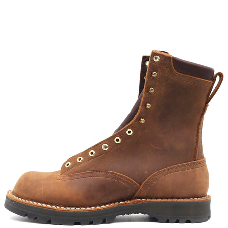 A brown distressed leather lace-up work boot with brass eyelets, a pull tab, and a black rubber sole, shown from a side profile on a white background.