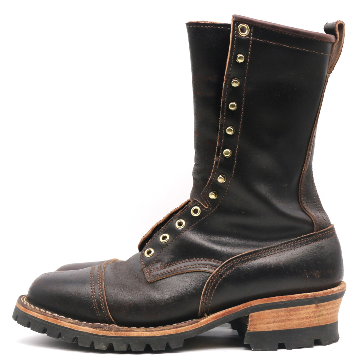 A dark brown leather lace-up boot with brass eyelets, a chunky wood-look heel, and a rugged black sole, shown from a side profile on a white background.