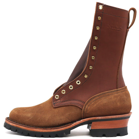 A brown leather and suede work boot with brass eyelets, a pull tab, and a chunky lug sole, shown from a side profile on a white background.