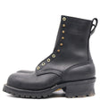A black leather work boot with gold-tone metal eyelets and studs, featuring a pull tab and a rugged lug sole, shown from a side profile on a white background.