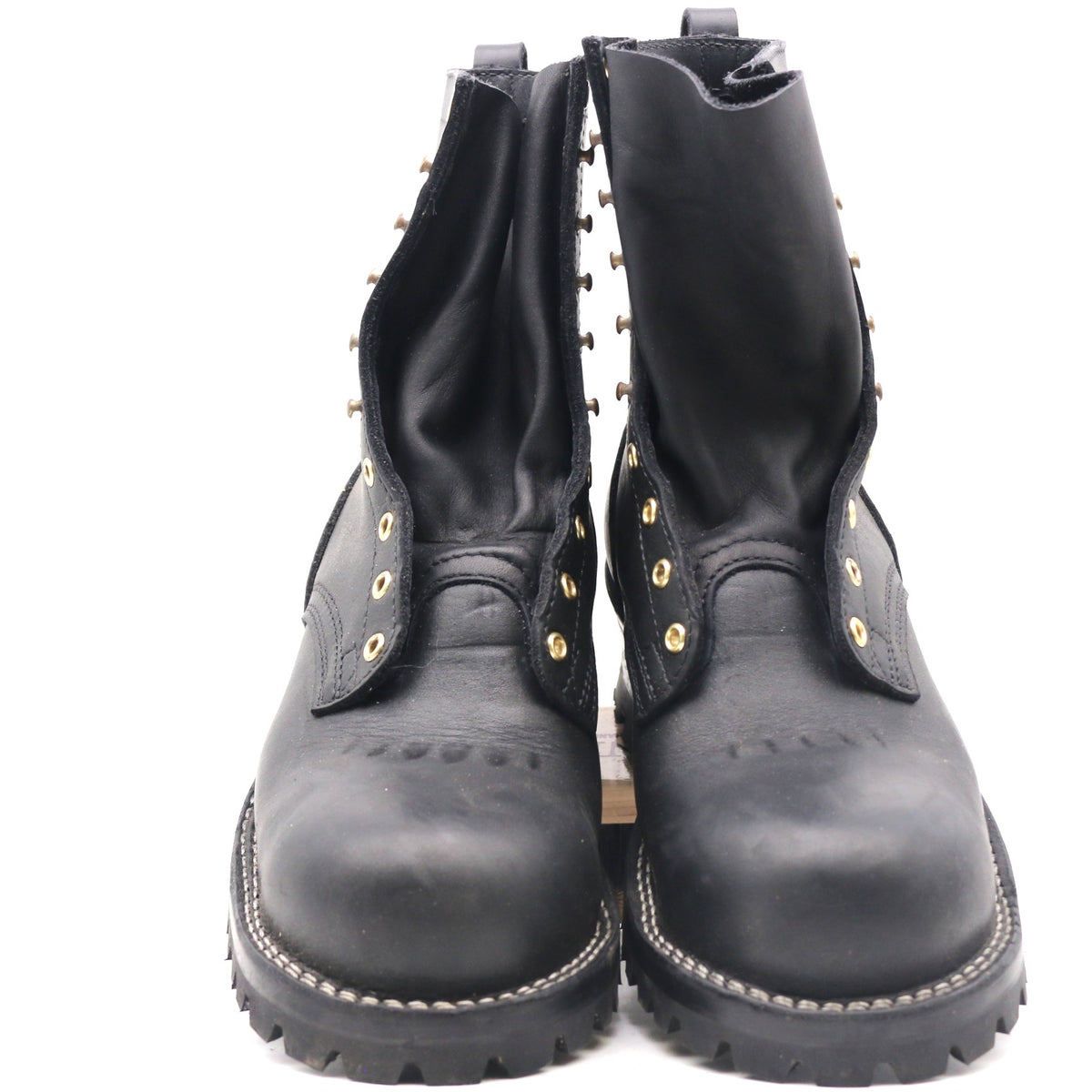 A pair of black leather lace-up ankle boots with gold-tone metal studs and eyelets, photographed against a plain white background.