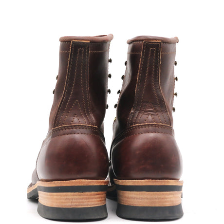 Rear view of brown leather lace-up work boots with stacked leather heels and stitched counter reinforcement