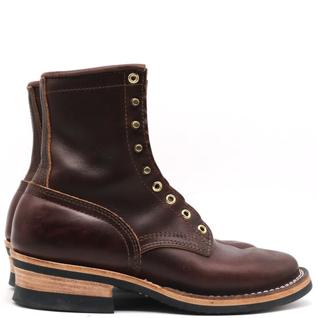 Dark brown leather lace-up boot with brass eyelets stacked leather heel and white welt stitching