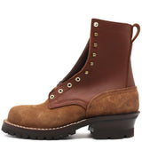 A brown leather lace-up ankle boot with a brown suede toe and heel, featuring brass eyelets and a black lug sole, shown from a side profile on a white background.