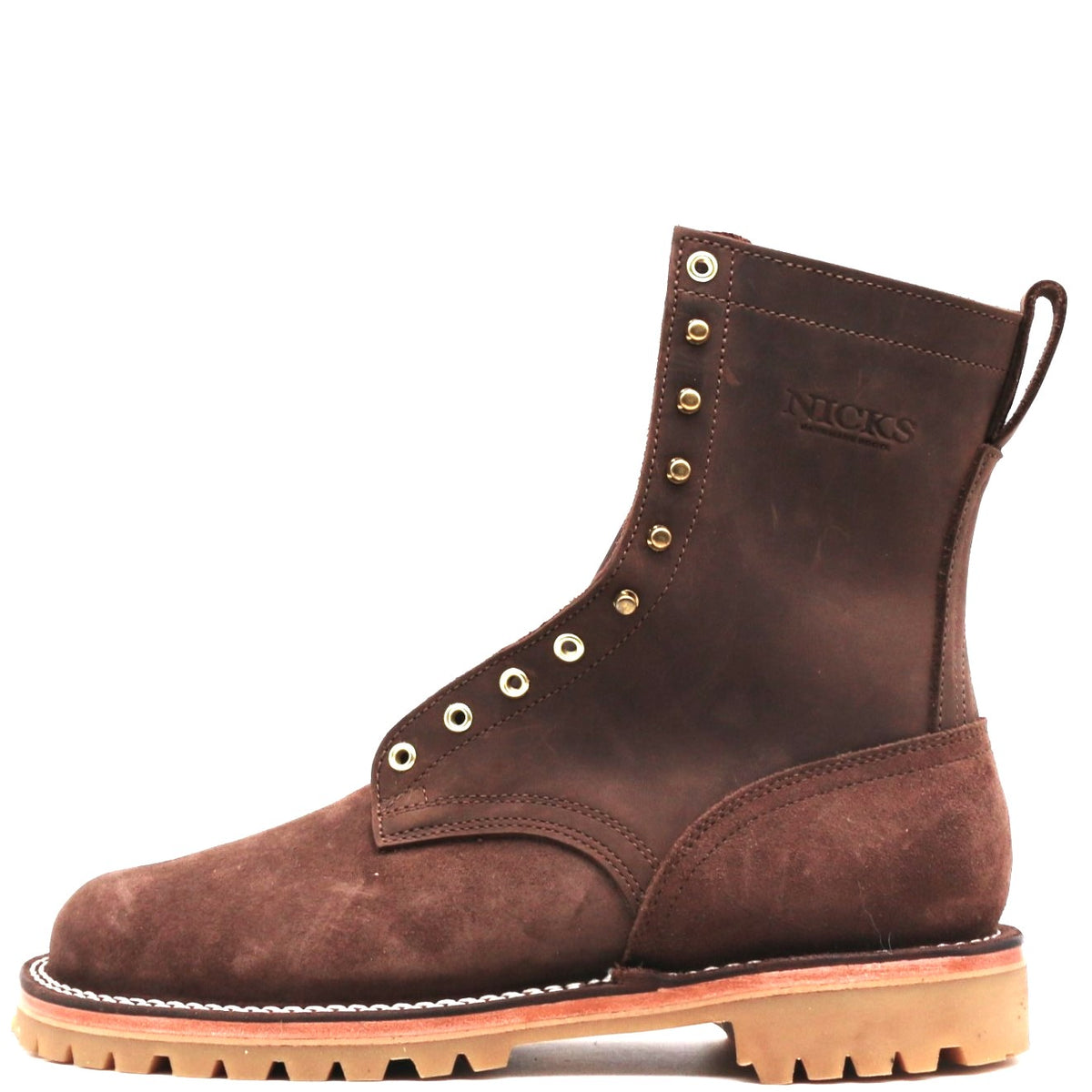 A dark brown suede lace-up ankle boot with brass eyelets, a pull tab, and a tan lug sole, shown from a side profile on a white background.