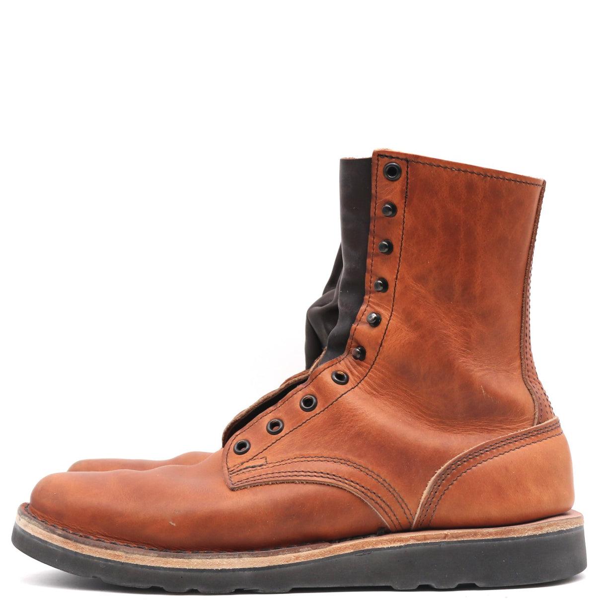 A single brown leather lace-up boot with a black sole and black laces, shown from a side profile on a white background.