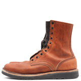 A single brown leather lace-up boot with a black sole and black laces, shown from a side profile on a white background.
