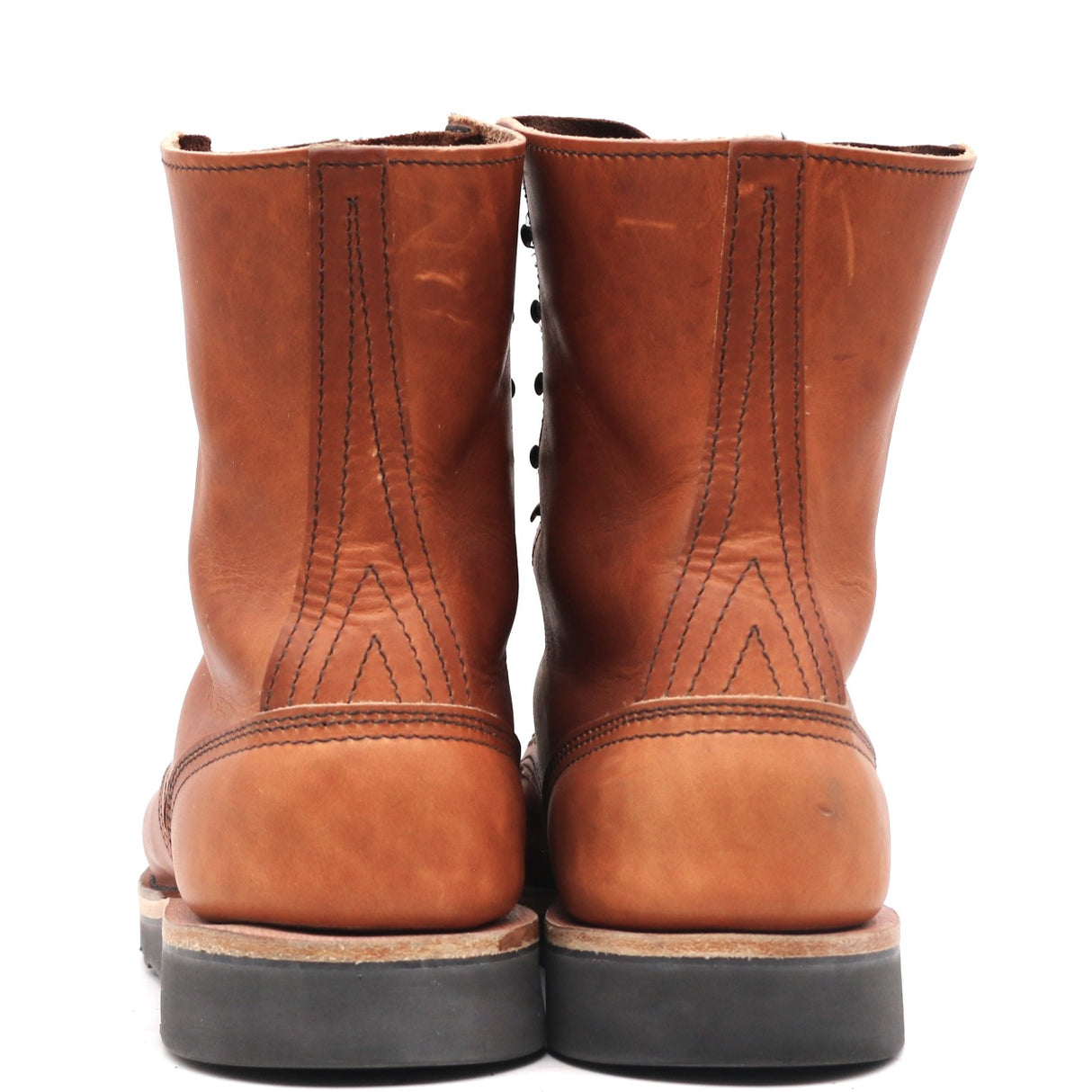 A pair of brown leather lace-up boots shown from the back, featuring decorative stitching and dark soles, set against a plain white background.