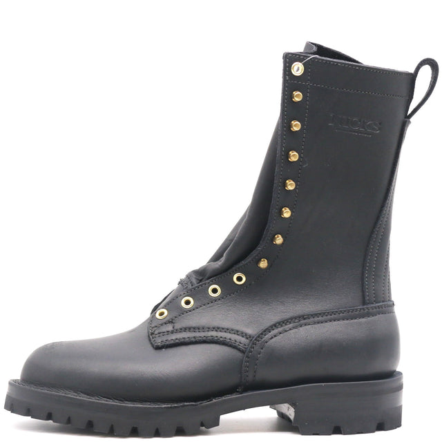 A black leather lace-up combat boot with gold-tone metal eyelets and studs, featuring a rugged sole and heel, shown against a plain white background.