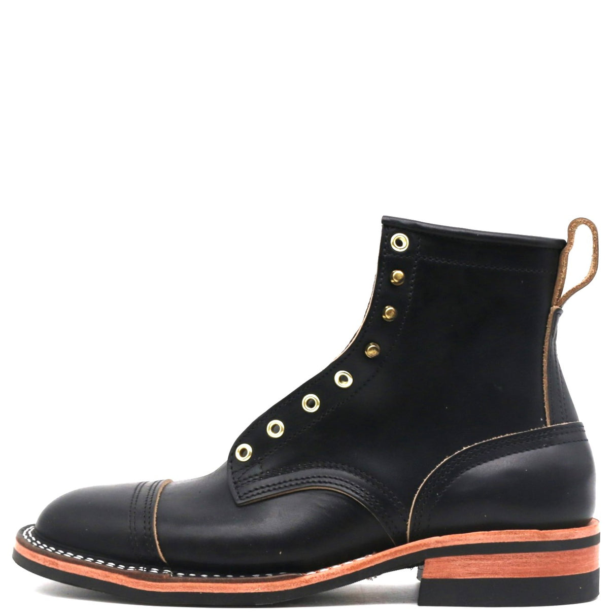 A single black leather lace-up ankle boot with brass eyelets, contrast stitching, and a stacked black sole with a bright orange-red midsole layer, shown against a plain white background.