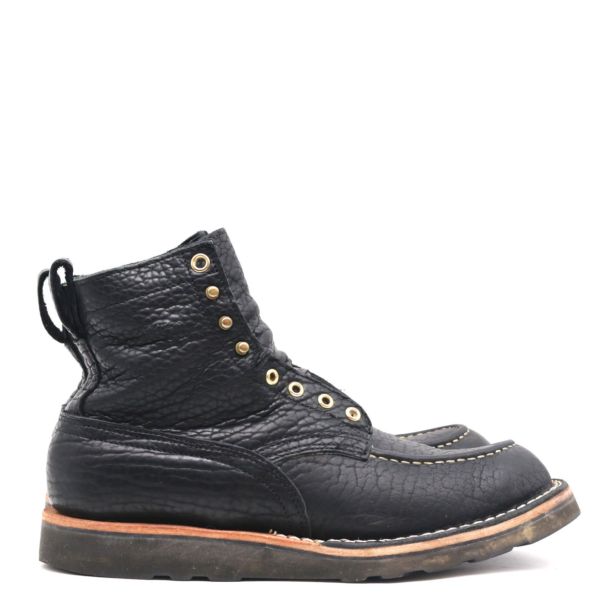 A single black leather lace-up boot with a textured grain finish, gold-tone eyelets, and a pull tab, shown from a side profile on a white background.