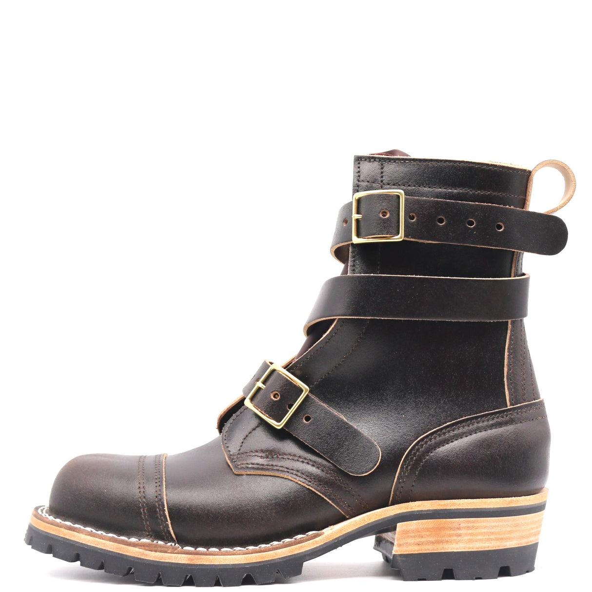 A dark brown leather ankle boot with multiple strap buckles, a pull loop, and a stacked wood-and-ferro sole, shown against a plain white background.