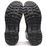 A pair of black lug sole boots shown from the back, displaying deep tread patterns and the embossed brand name 'Vionik' on the soles against a white background.