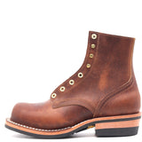 A single brown leather lace-up ankle boot with brass grommets, a stacked wood-look heel, and a black outsole, shown from a side profile on a white background.