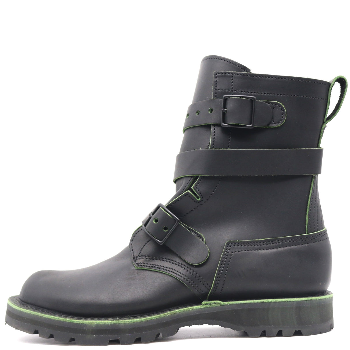 A black leather ankle boot with three adjustable straps and a rugged sole, featuring bright green contrast stitching and trim.
