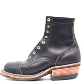 A black leather lace-up ankle boot with brass eyelets, a rounded toe, and a stacked wood-look heel, shown from a side profile on a white background.