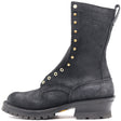 A black suede lace-up work boot with gold-tone metal studs and eyelets, a thick black lug sole, and a stacked heel, shown from a side profile on a white background.