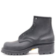 A single black leather lace-up work boot with a rugged lug sole and block heel, shown from a side profile on a white background.