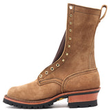 Tall brown leather boot with brass hardware and a fireproof lug outsole against a white background.