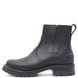 Black pull on boot with elastic Chelsea flaps, black lug outsole, and a rear pull loop in front of a white background.