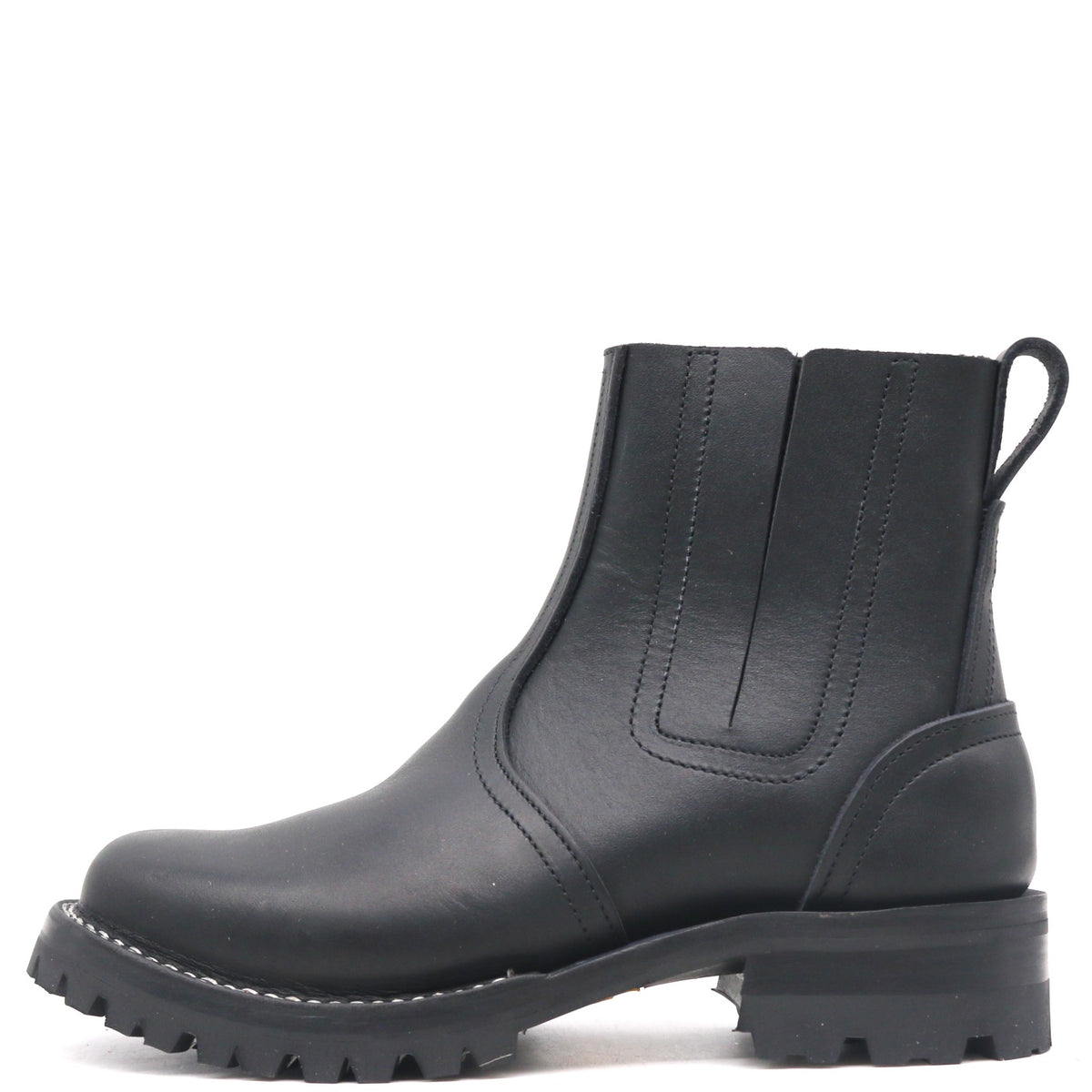 Black pull on boot with elastic Chelsea flaps, black lug outsole, and a rear pull loop in front of a white background.