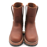 A pair of brown leather mid-calf boots with pull tabs and thick black lug soles, shown from a front-facing perspective on a white background.