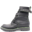 A black leather ankle boot with multiple adjustable straps and a rugged sole, featuring a thin green contrast stitch and green trim along the sole.
