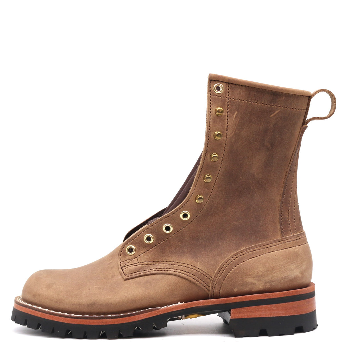 A brown suede lace-up ankle boot with brass eyelets, a pull loop, and a rugged black lug sole, shown from a side profile on a white background.