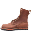 Flat brown leather boot with brass hardware and flat outsole in front of a white background.