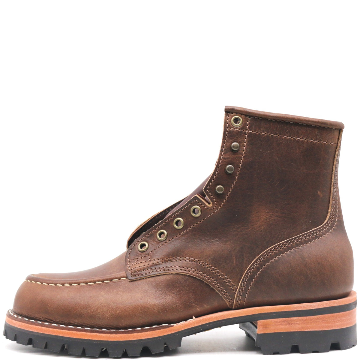 Brown leather moccasin toe ankle boot with rolled top, antique hardware, and black outsole in front of a white background.