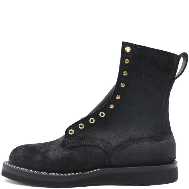 Black leather boot with brass hardware, rear pull loop, and black wedge outsole.