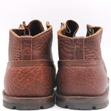 A pair of brown pebbled leather lace-up boots shown from the back against a plain white background.