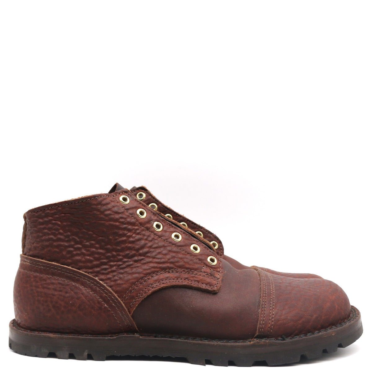 A single dark brown leather lace-up boot with a textured pebbled finish, brass eyelets, and a rugged black sole, shown against a plain white background.