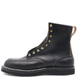 A black leather ankle boot with gold metal eyelets, white contrast stitching, and a pull tab on the heel, shown from a side profile on a white background.
