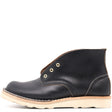 Black leather boot with a white background